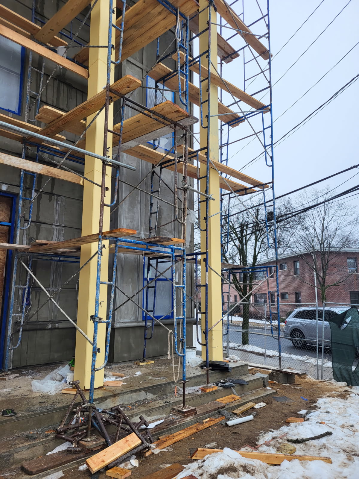 Scaffolding around masonry columns during construction